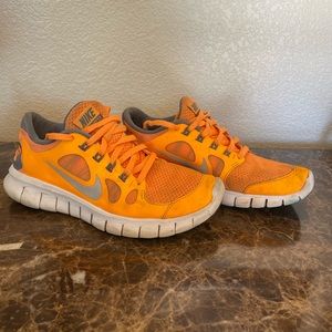 Bright orange nike shoes